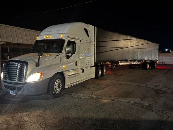 Semi truck at night freight yard